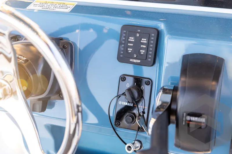 Slide: The Image of 2026 Tidewater 2110 Bay Max boat dashboard with Yamaha controls and Lectrotab panel. - 55