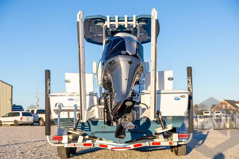 Slide: The Image of 2026 Tidewater 2110 Bay Max boat on trailer, rear view, sunny day. - 6
