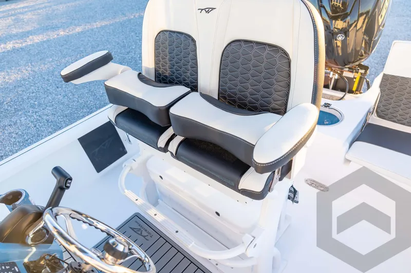 Slide: The Image of 2026 Tidewater 2110 Bay Max boat interior with stylish seating and steering wheel. - 62