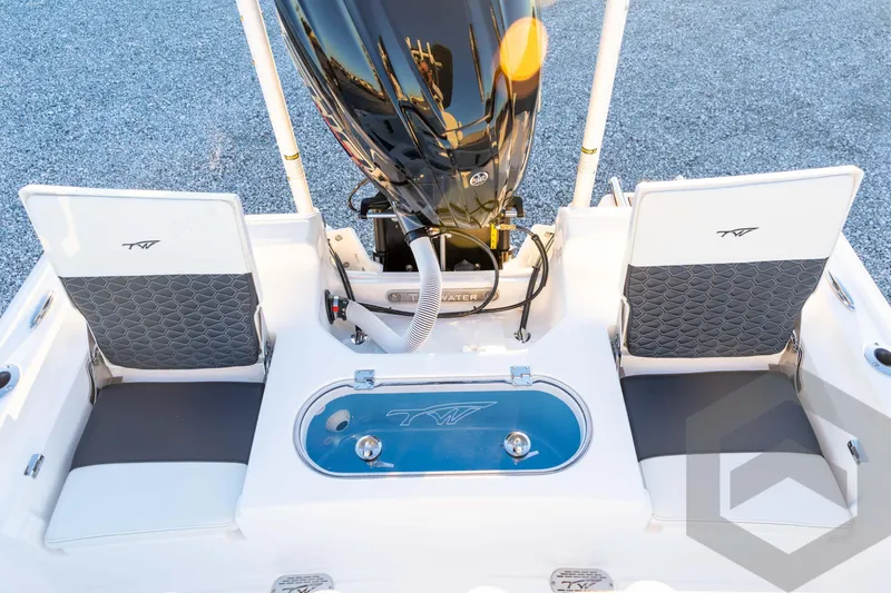 Slide: The Image of 2026 Tidewater 2110 Bay Max boat interior with seating and motor, showcasing modern design. - 63