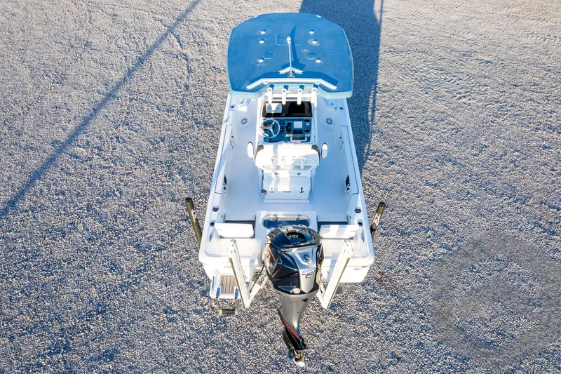 Slide: The Image of 2026 Tidewater 2110 Bay Max boat, aerial view, showcasing deck and motor. - 76