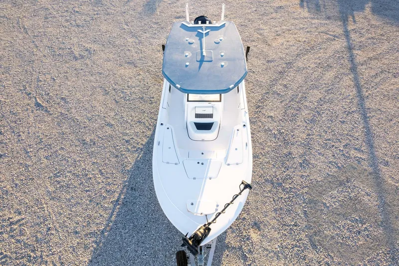 Slide: The Image of 2026 Tidewater 2110 Bay Max boat, aerial view on gravel surface. - 80