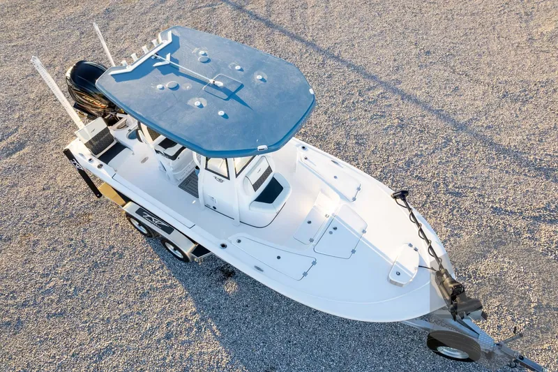 Slide: The Image of 2026 Tidewater 2110 Bay Max boat on trailer, aerial view, parked on gravel. - 81