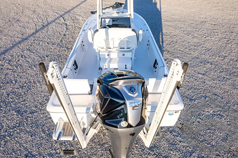 Slide: The Image of 2026 Tidewater 2110 Bay Max boat with powerful outboard motor, viewed from above. - 84