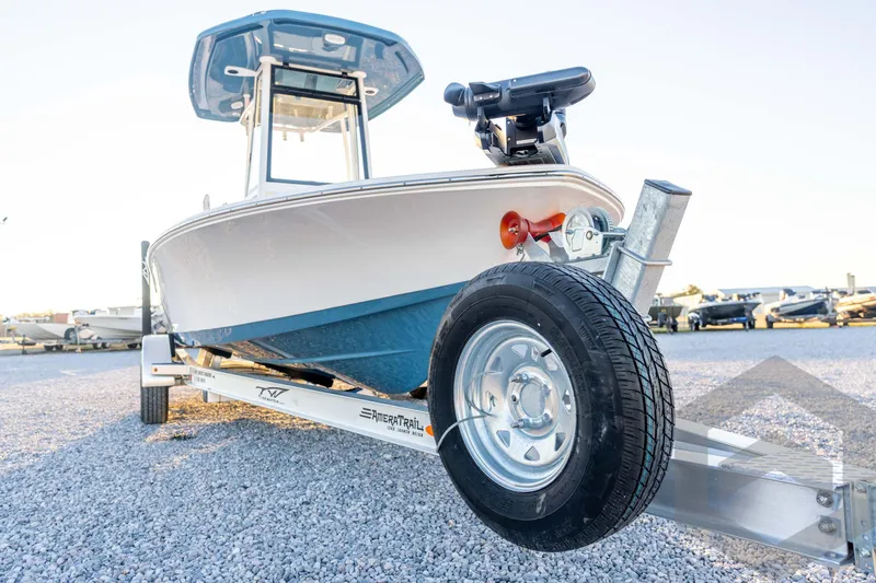 Slide: The Image of 2026 Tidewater 2110 Bay Max boat on trailer, parked on gravel lot. - 9