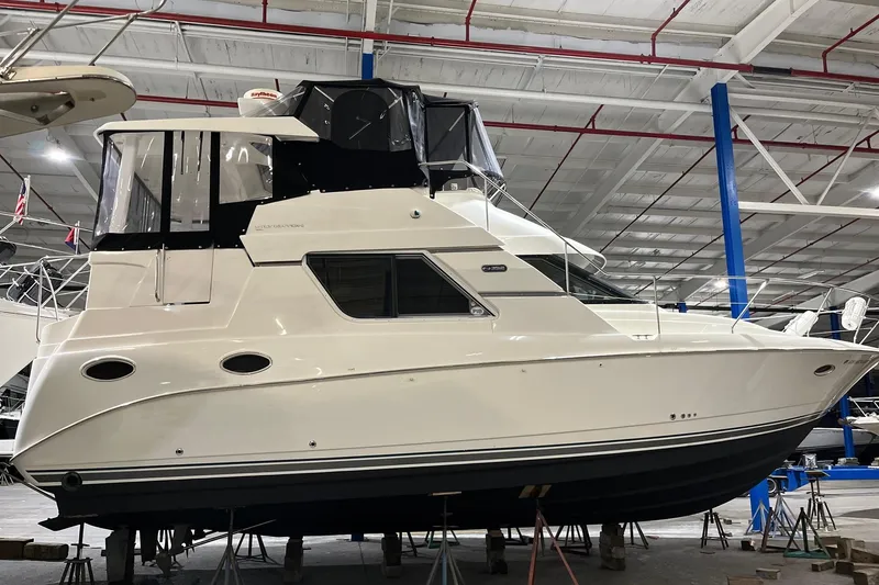 The Image of 1998 Silverton 352 Motor Yacht in indoor storage, side view. - 0