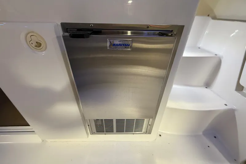 Slide: The Image of Stainless steel Raritan fridge on 1998 Silverton 352 Motor Yacht, near white steps. - 16