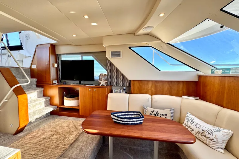 Slide: The Image of Luxurious 1998 Silverton 352 Motor Yacht interior with cozy seating and modern amenities. - 27