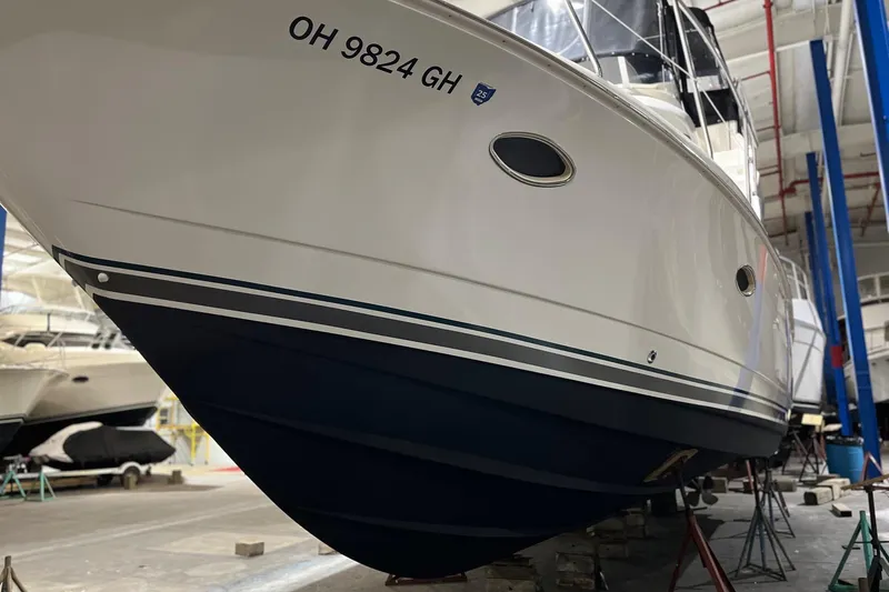 Slide: The Image of 1998 Silverton 352 Motor Yacht in storage, showcasing sleek hull design. - 3