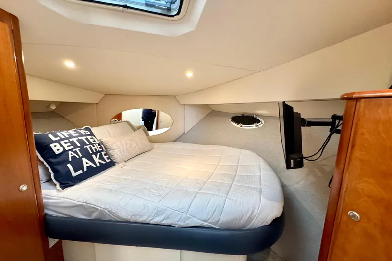 Slide: The Image of 1998 Silverton 352 Motor Yacht cabin with cozy bed and decorative pillows. - 33