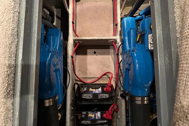 Slide: The Image of Engine room of a 1998 Silverton 352 Motor Yacht with blue engines. - 39