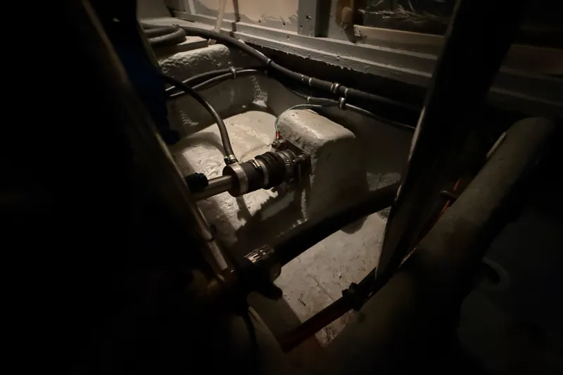 Slide: The Image of Engine room of a 1998 Silverton 352 Motor Yacht, showing mechanical components and piping. - 45