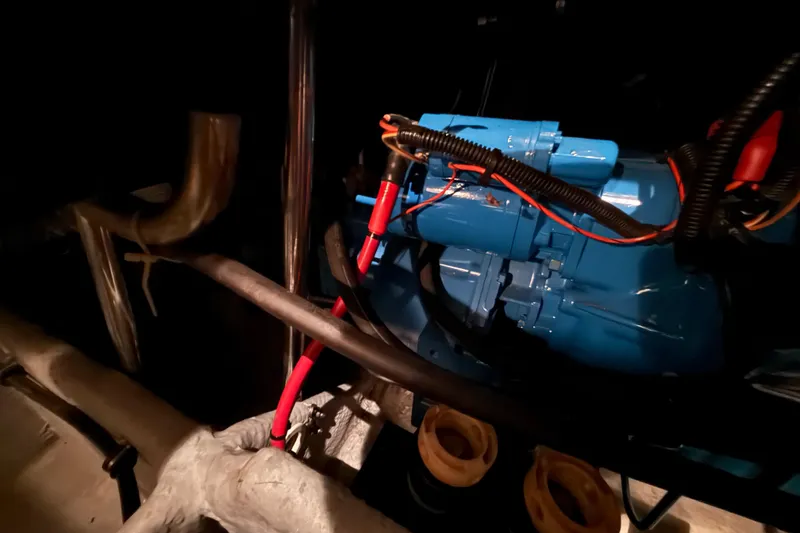 Slide: The Image of Engine compartment of a 1998 Silverton 352 Motor Yacht with visible wiring and components. - 47