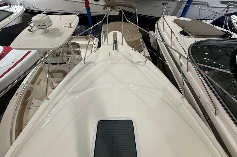 Slide: The Image of 1998 Silverton 352 Motor Yacht docked among other boats in a marina. - 5