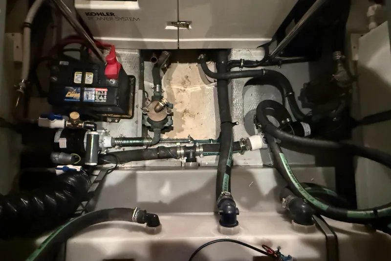 Slide: The Image of Engine room of a 1998 Silverton 352 Motor Yacht with Kohler power system and battery. - 53