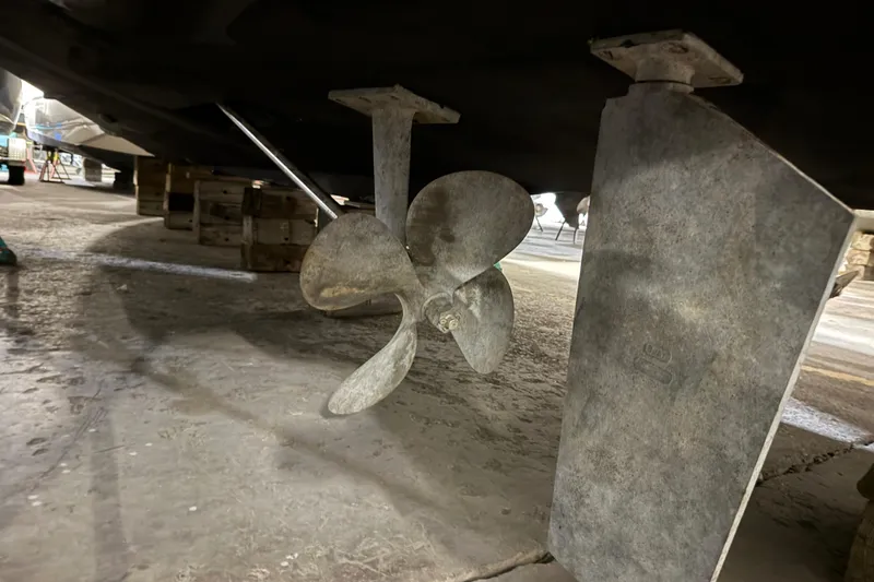 Slide: The Image of Propeller and rudder of 1998 Silverton 352 Motor Yacht in dry dock. - 60