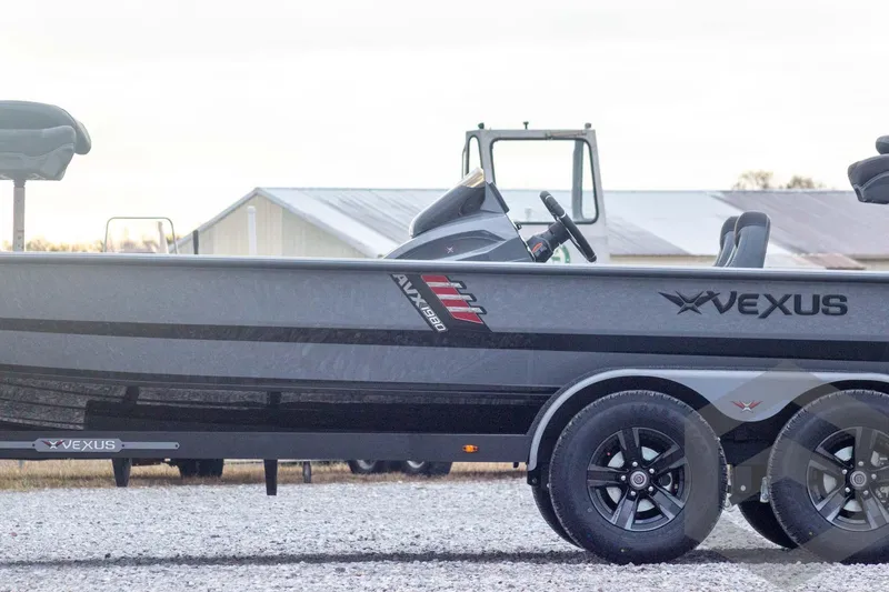 Slide: The Image of 2026 Vexus AVX 1980 boat on trailer, side view, outdoors. - 15