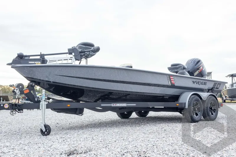 Slide: The Image of 2026 Vexus AVX 1980 boat on trailer, featuring Minn Kota motor, parked on gravel. - 18