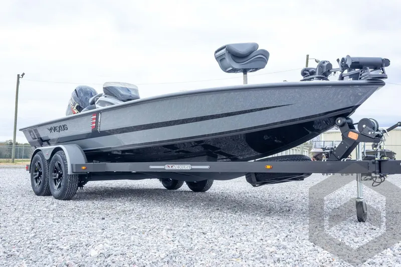 Slide: The Image of 2026 Vexus AVX 1980 boat on trailer, sleek design, parked on gravel. - 20