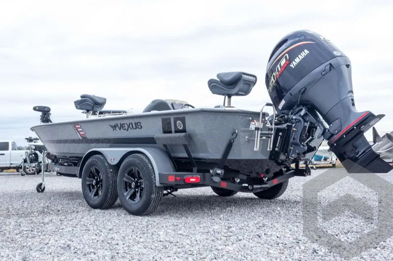 Slide: The Image of 2026 Vexus AVX 1980 boat with Yamaha engine on a trailer, parked on gravel. - 24