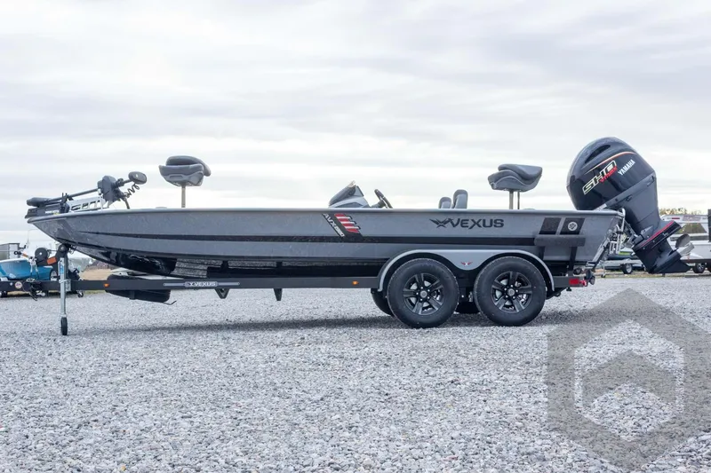 Slide: The Image of 2026 Vexus AVX 1980 boat on trailer with Yamaha motor, parked on gravel. - 25