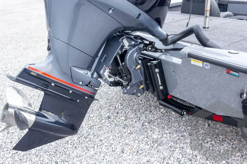 Slide: The Image of 2026 Vexus AVX 1980 boat engine and propeller on gravel surface. - 33