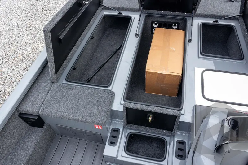 Slide: The Image of 2026 Vexus AVX 1980 boat storage compartments with cardboard box inside. - 44