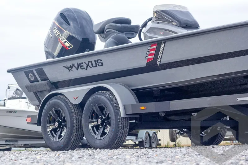 Slide: The Image of 2026 Vexus AVX 1980 boat on trailer, featuring sleek design and Yamaha engine. - 5