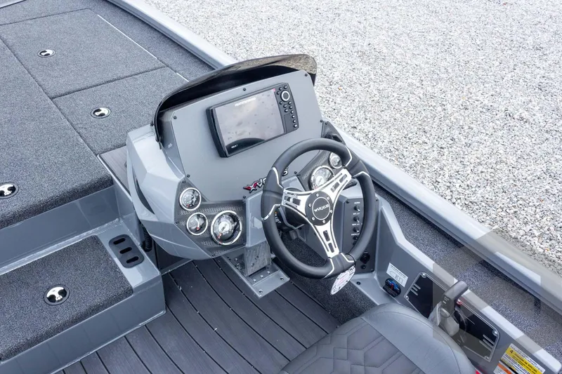 Slide: The Image of 2026 Vexus AVX 1980 boat cockpit with modern steering and control panel. - 56