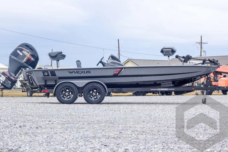 Slide: The Image of 2026 Vexus AVX 1980 boat with Yamaha engine on trailer, parked outdoors. - 6