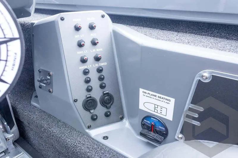 Slide: The Image of Control panel of 2026 Vexus AVX 1980 boat with switches and seating instructions. - 62