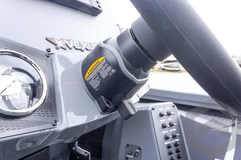 Slide: The Image of 2026 Vexus AVX 1980 boat dashboard with steering wheel and RPM gauge. - 63