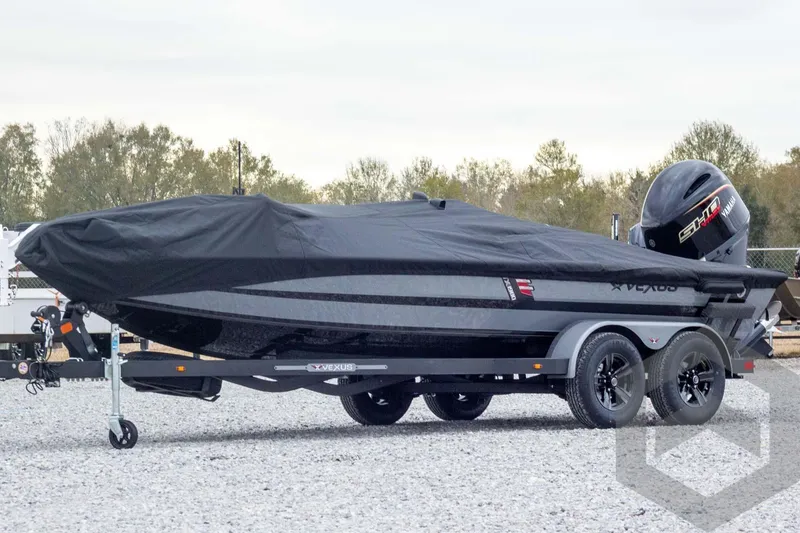 Slide: The Image of 2026 Vexus AVX 1980 boat with cover on trailer, parked outdoors. - 68