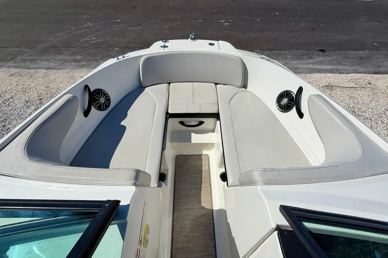 Slide: The Image of 2023 Sea Ray SPX 210 Outboard boat interior with spacious seating and modern design. - 11