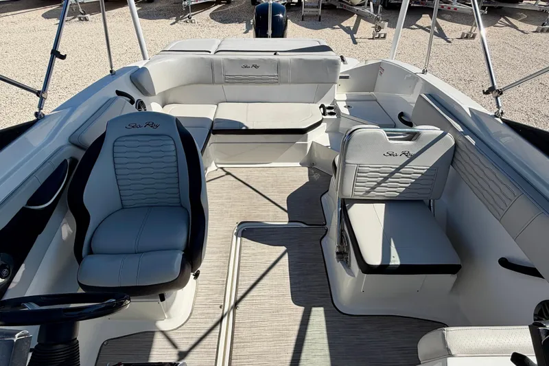Slide: The Image of 2023 Sea Ray SPX 210 Outboard boat interior with stylish seating and modern design. - 15
