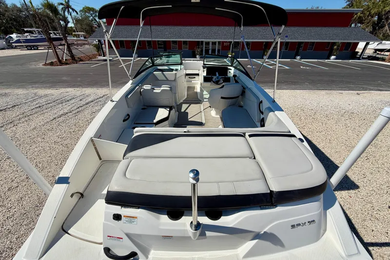 Slide: The Image of 2023 Sea Ray SPX 210 Outboard boat with spacious seating and modern design. - 24