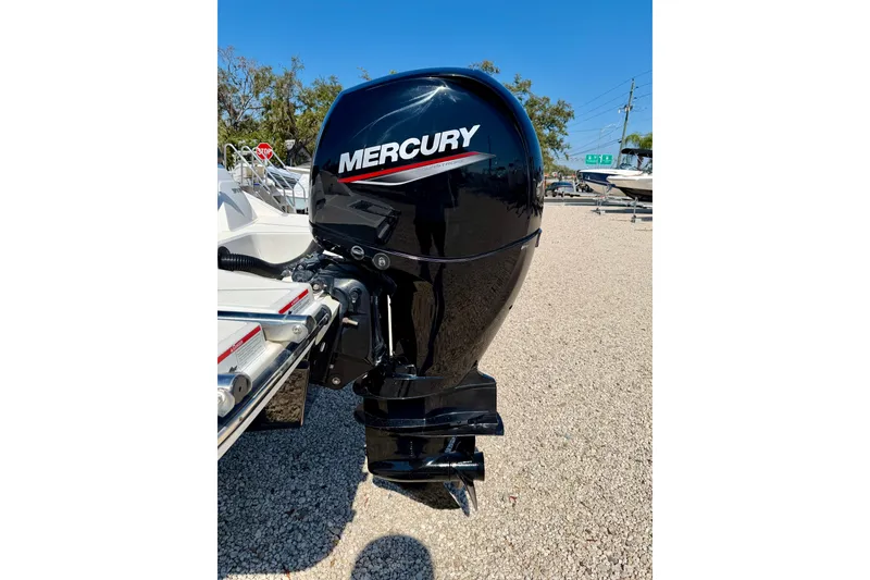 Slide: The Image of 2023 Sea Ray SPX 210 Outboard with Mercury engine, parked on gravel. - 30