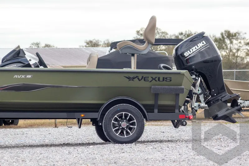Slide: The Image of 2026 Vexus Defender 181 boat with Suzuki outboard motor, side view. - 10