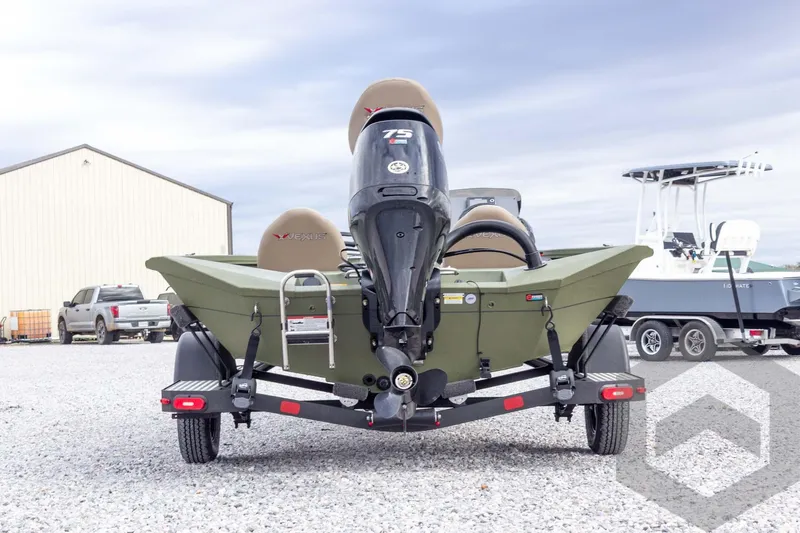 Slide: The Image of 2026 Vexus Defender 181 boat on trailer, rear view, outdoor setting. - 16