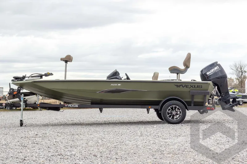 Slide: The Image of 2026 Vexus Defender 181 boat with Suzuki outboard motor on a trailer, side view. - 18