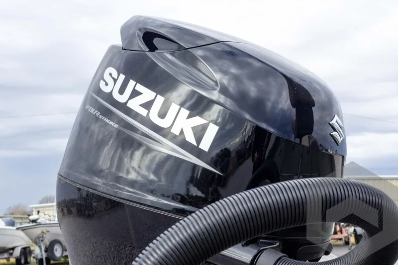 Slide: The Image of Suzuki four-stroke engine on 2026 Vexus Defender 181 boat, outdoor setting. - 23