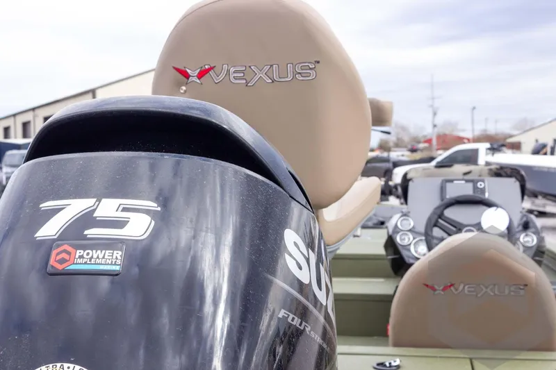 Slide: The Image of 2026 Vexus Defender 181 boat with 75 HP engine, featuring sleek design and advanced controls. - 25