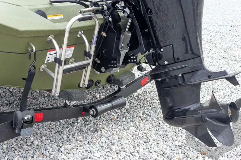 Slide: The Image of Rear view of 2026 Vexus Defender 181 boat with motor and ladder. - 27