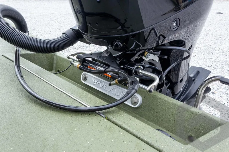 Slide: The Image of 2026 Vexus Defender 181 boat engine detail with hydraulic steering system. - 29
