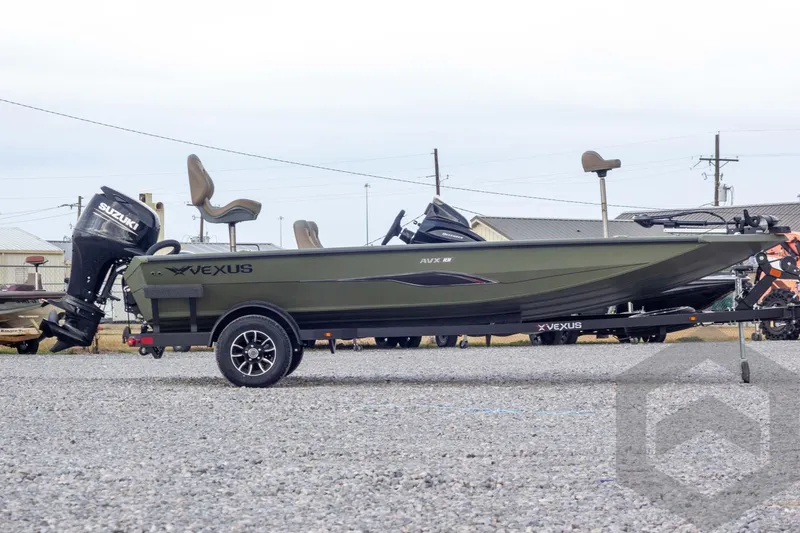 Slide: The Image of 2026 Vexus Defender 181 boat with Suzuki outboard motor on a trailer. - 3