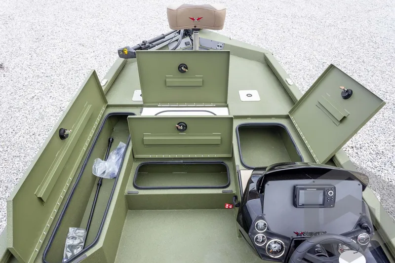 Slide: The Image of 2026 Vexus Defender 181 boat interior with open storage compartments and control panel. - 31