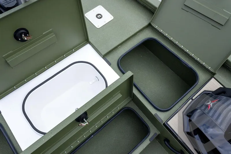 Slide: The Image of 2026 Vexus Defender 181 boat storage compartments and livewell, showcasing interior design. - 33