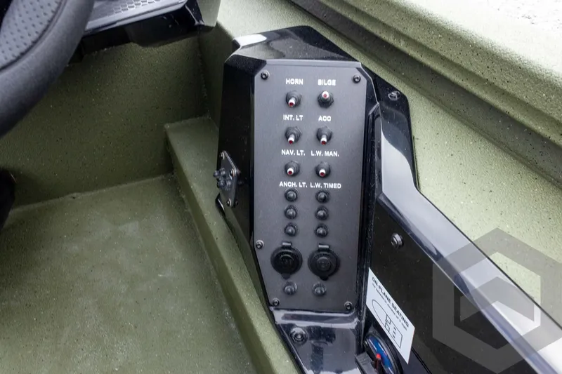 Slide: The Image of Control panel of 2026 Vexus Defender 181 boat with various switches and buttons. - 43