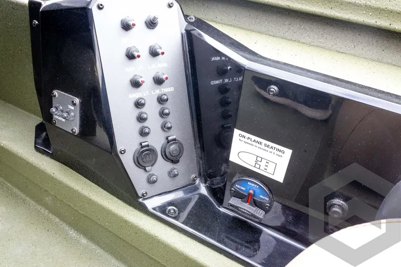 Slide: The Image of Control panel of 2026 Vexus Defender 181 boat with switches and seating instructions. - 44
