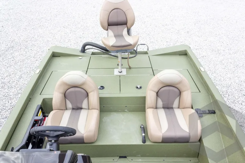 Slide: The Image of 2026 Vexus Defender 181 boat interior with three beige and brown seats. - 46